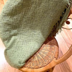 Pottery Barn green throw blanket.
